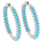 Elegant round blue turquoise sterling silver earrings with sparkling gemstones, perfect for a sophisticated collection.